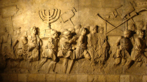 Roman soldiers carrying the Golden Menorah as plunder.